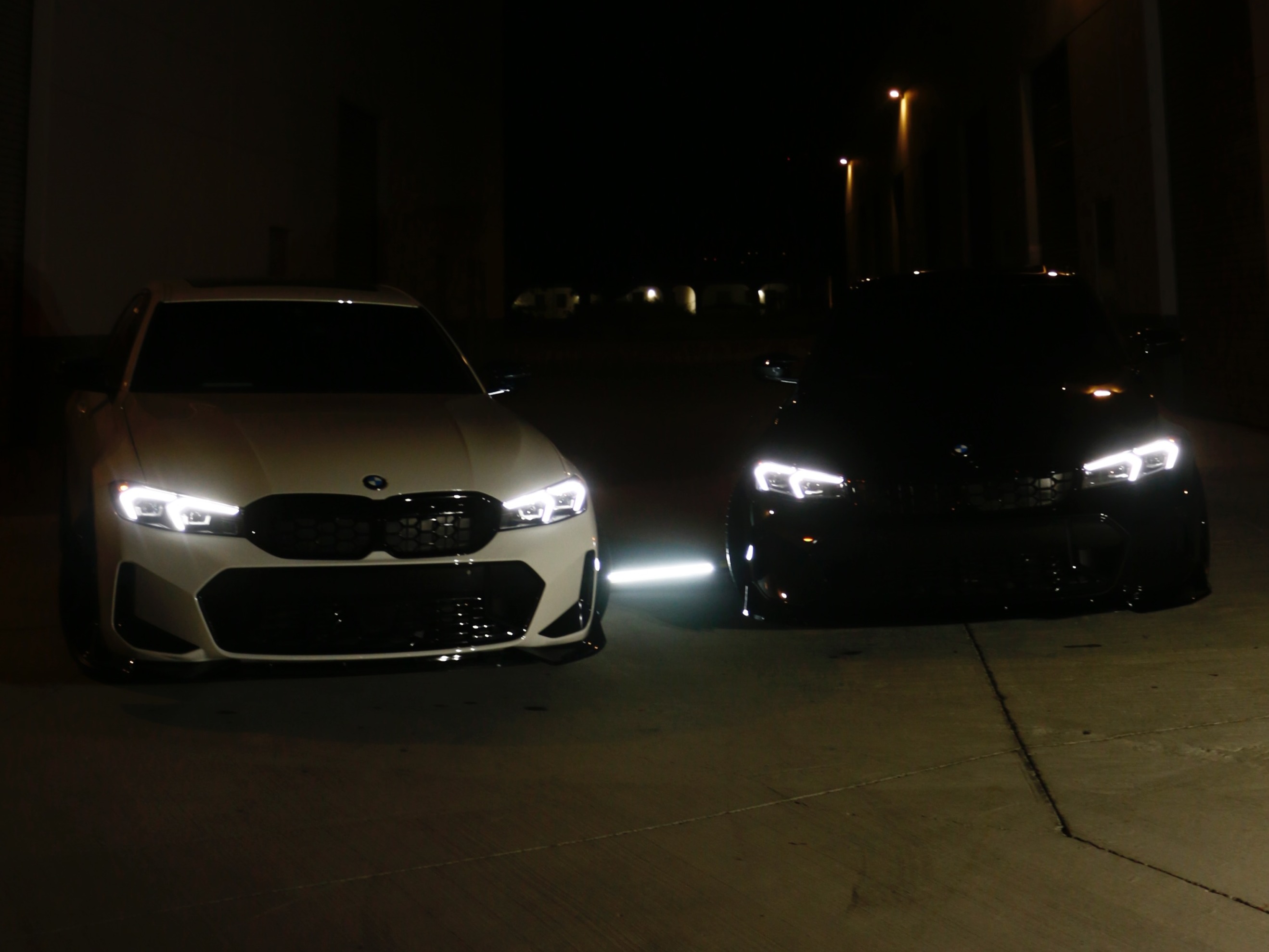 Two BMW M340i detailed at night